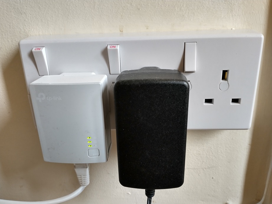 Three way socket fitted to a two way back box, creating an extra socket without cutting holes in walls.